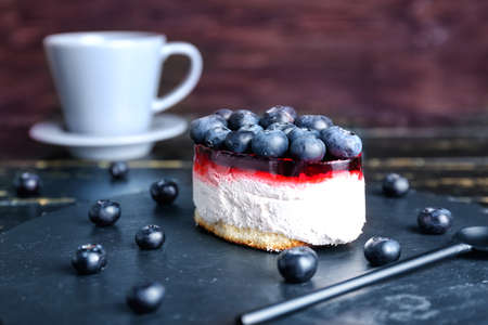 Tasty cake with berries on slate plateの写真素材