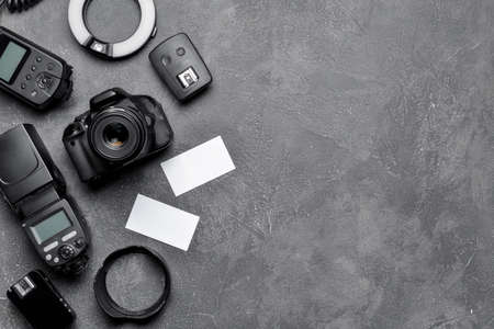 Modern photographer's equipment with cards on dark backgroundの写真素材