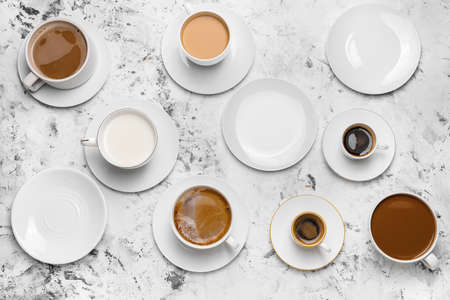 Composition with cups of different coffee on light backgroundの写真素材