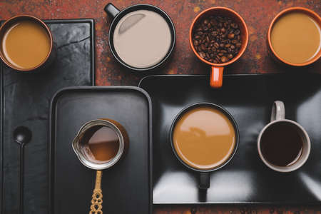 Composition with cups of different coffee on grunge backgroundの写真素材