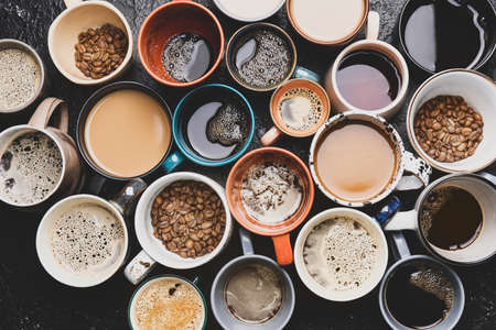 Many cups of different coffee on dark backgroundの写真素材