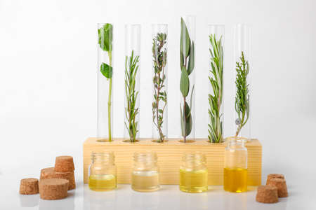 Test tubes with different essential oils on white backgroundの写真素材
