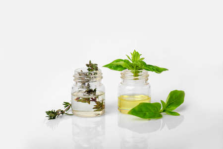 Bottles with different essential oils on white backgroundの写真素材
