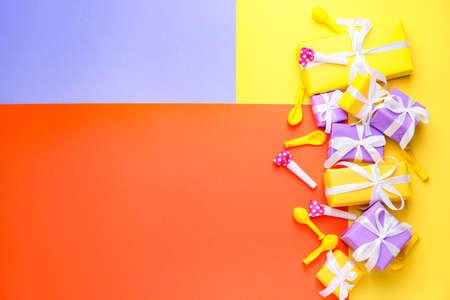Many Birthday gifts and decor on color backgroundの写真素材