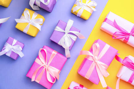 Many Birthday gifts on color backgroundの写真素材