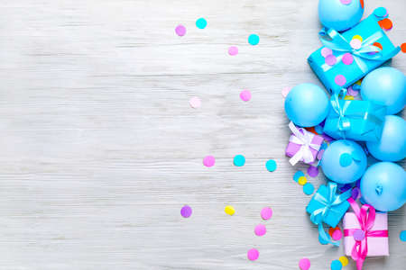 Many Birthday gifts and decor on wooden backgroundの写真素材