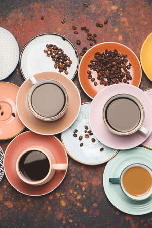 Composition with cups of different coffee on grunge backgroundの写真素材