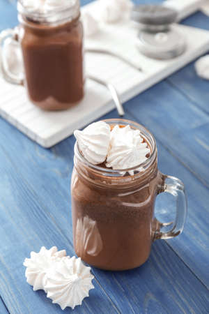 Mason jar of hot chocolate on table