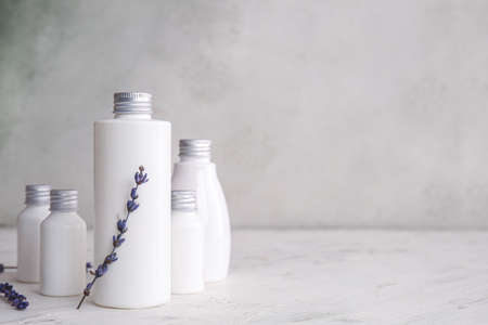 Bottles of shampoo on tableの写真素材