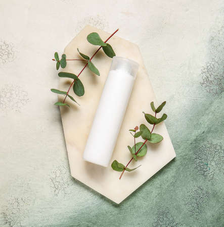 Shampoo with herbal extract on color backgroundの写真素材