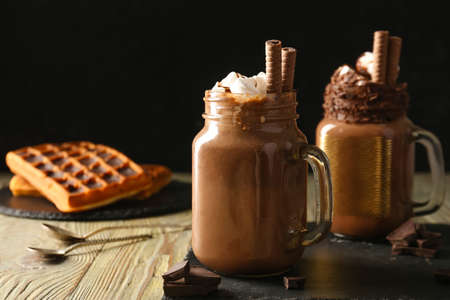 Mason jars of hot chocolate on tableの写真素材