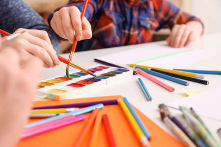 Drawing teacher giving private lessons at home, closeupの写真素材