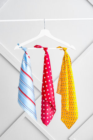 Hanger with different beautiful scarves on rackの写真素材