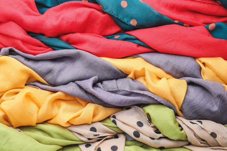 Different beautiful scarves as backgroundの写真素材