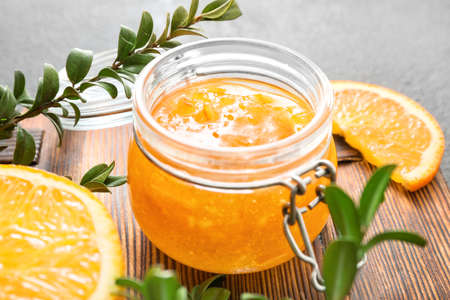Jar of orange jam on tableの写真素材