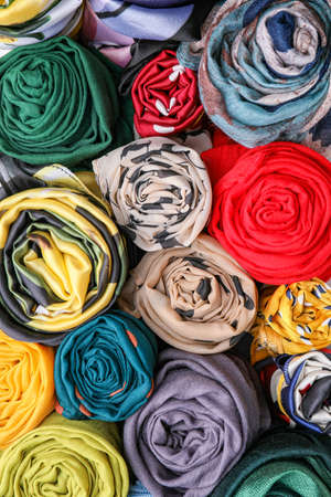 Different beautiful scarves as backgroundの写真素材