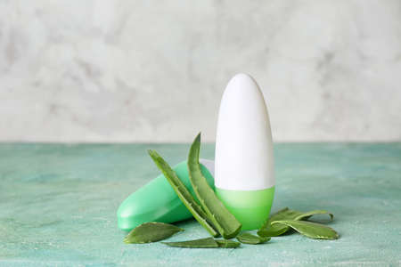 Different deodorants on color backgroundの写真素材