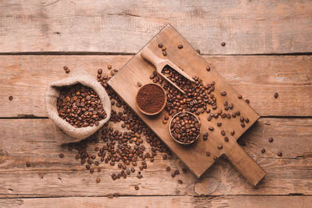 Composition with coffee beans on wooden backgroundの写真素材