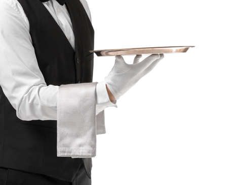 Handsome male waiter with empty tray on white backgroundの写真素材
