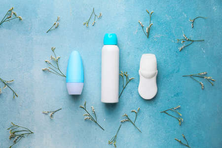Different deodorants on color backgroundの写真素材