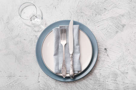Beautiful table setting on gray background