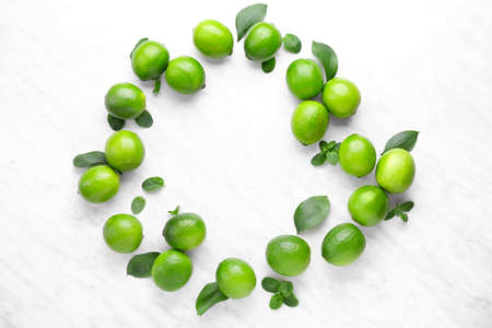 Fresh limes on light backgroundの写真素材