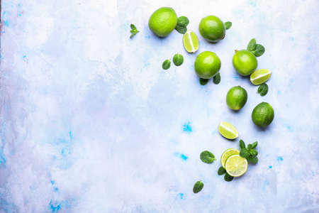 Fresh limes on color background