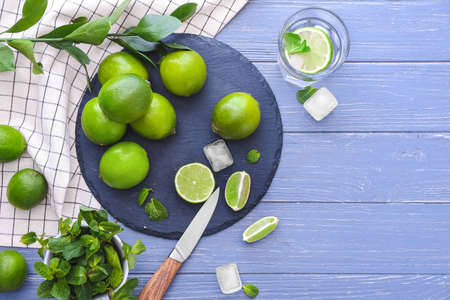 Composition with fresh limes on wooden backgroundの写真素材