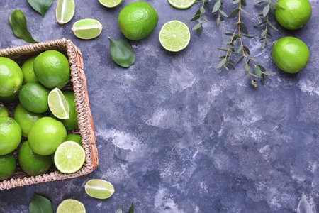 Fresh limes on color backgroundの写真素材