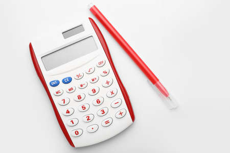 Modern calculator with pen on white backgroundの写真素材