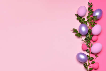 Beautiful Easter eggs on color backgroundの写真素材