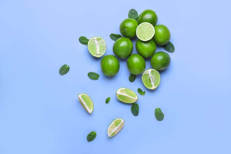 Fresh limes on color backgroundの写真素材