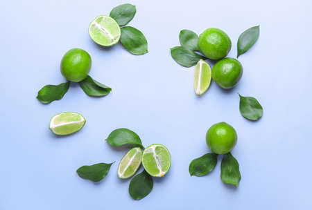 Fresh limes on color backgroundの写真素材