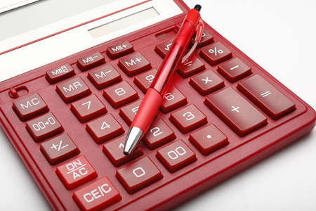 Modern calculator with pen on white backgroundの写真素材