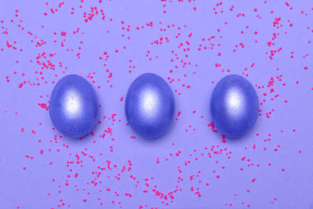 Beautiful Easter eggs on color backgroundの写真素材