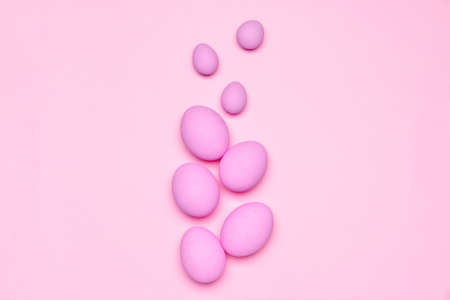 Beautiful Easter eggs on color backgroundの写真素材