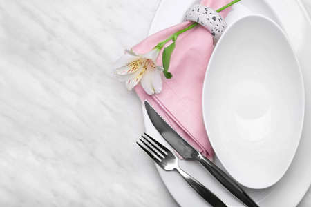 Beautiful table setting with floral decorの写真素材