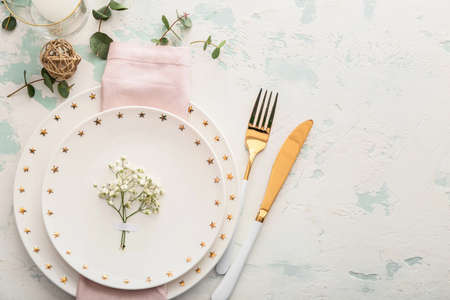 Beautiful table setting with floral decorの写真素材