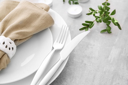 Beautiful table setting with floral decorの写真素材