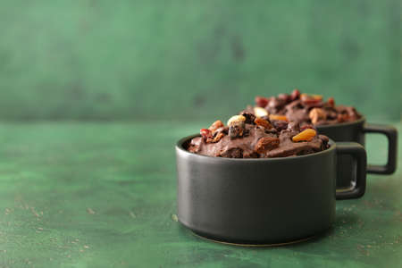 Chocolate mug cakes on color backgroundの写真素材