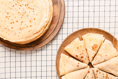 Tasty blini on table, top view