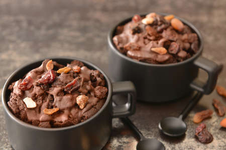 Chocolate mug cakes on dark backgroundの写真素材