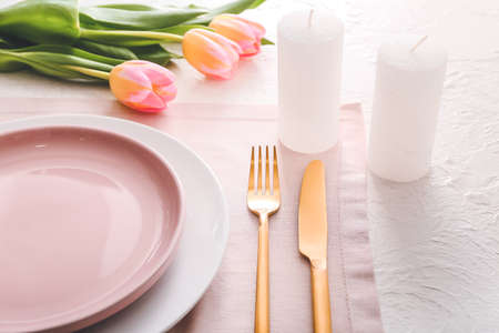 Beautiful table setting with floral decorの写真素材