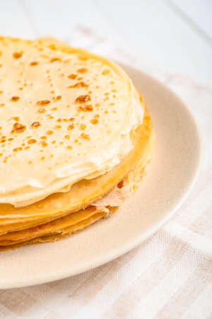Plate with tasty blini on table, closeupの写真素材