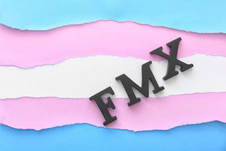 Letters F, M, X on color background. Concept of transgenderの写真素材