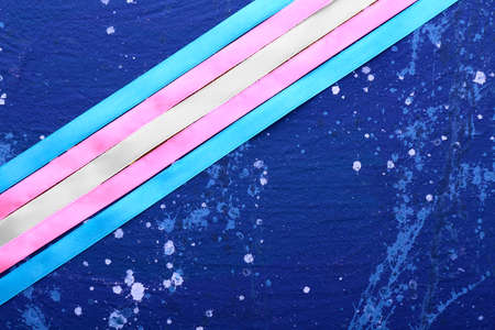 Ribbons on color background. Concept of transgenderの写真素材