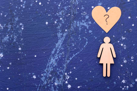 Female figure with question mark on color background. Concept of transgenderの写真素材
