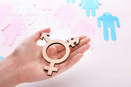 Female hand with symbol of transgender on white backgroundの写真素材