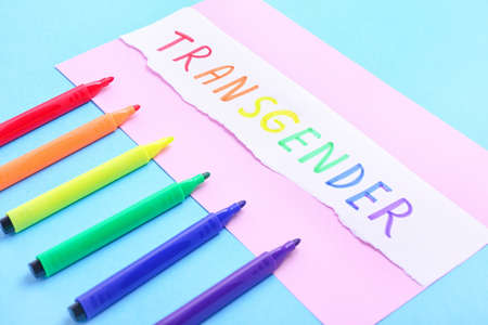 Paper with word TRANSGENDER and markers on color backgroundの写真素材