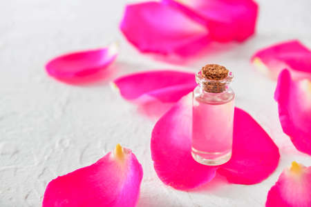 Bottle of rose essential oil on white backgroundの写真素材